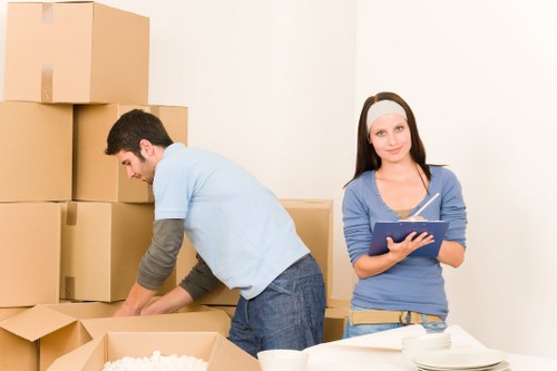 Whitton resident packing boxes into a mobile storage container